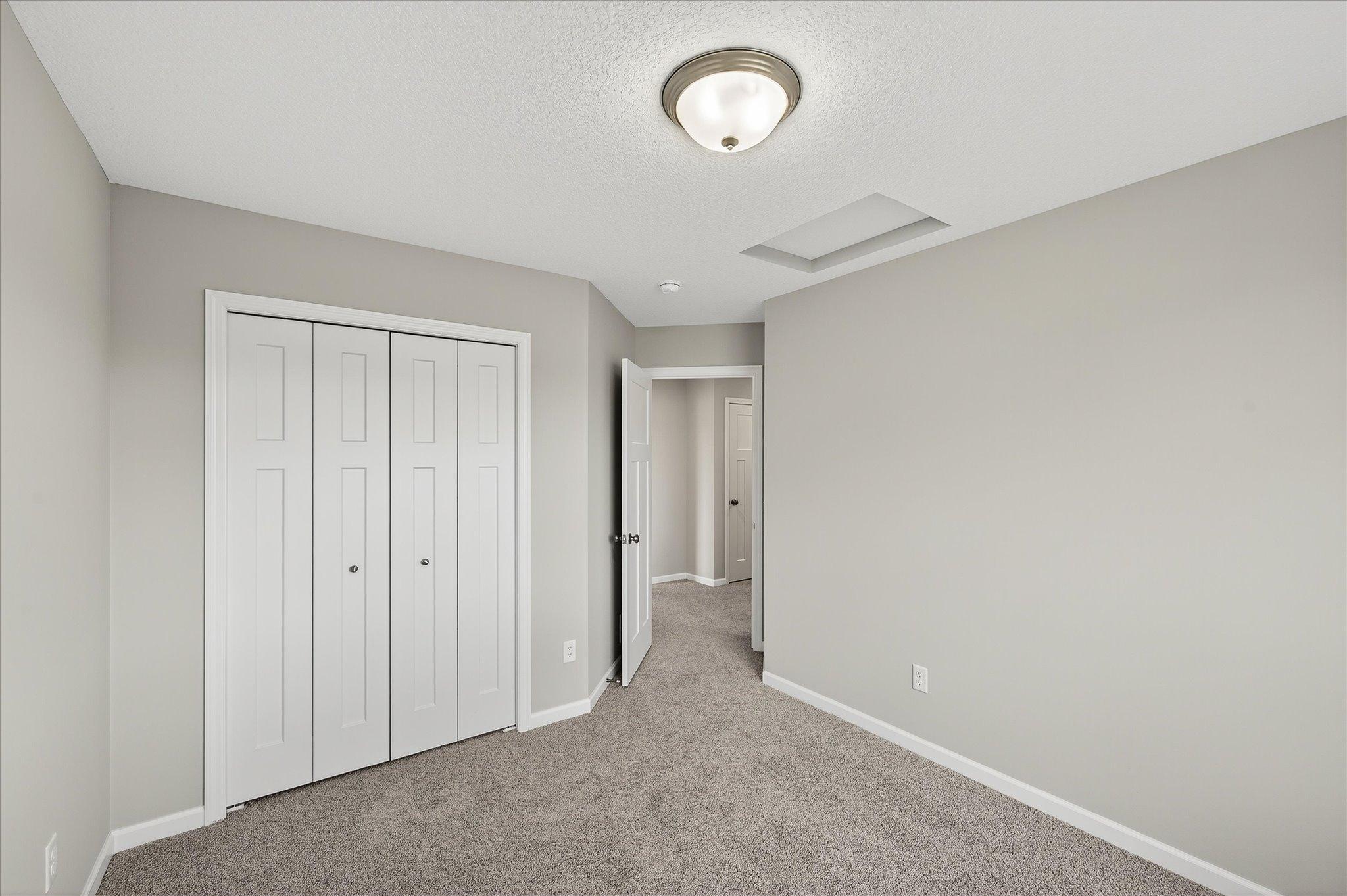 Another comfortable bedroom gives everyone the opportunity to have a space of their own. *photos of a previously staged home, not all options & finishes may be exact.*