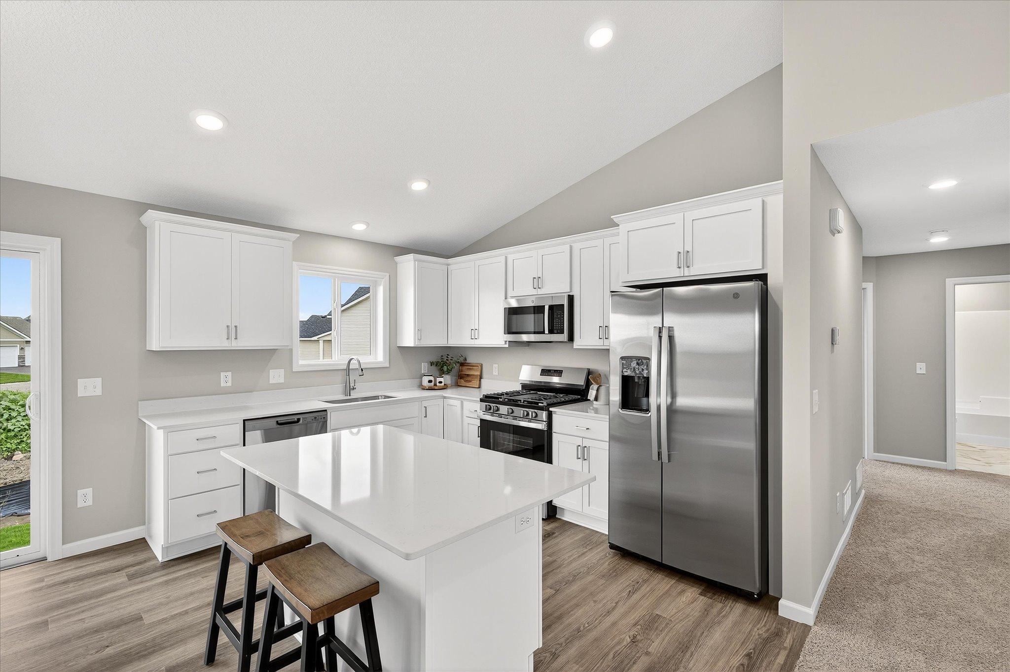 Plenty of cabinetry keeps everyday essentials organized and your countertops ready for whatever's on the menu. *photos of a previously staged home, not all options & finishes may be exact.*