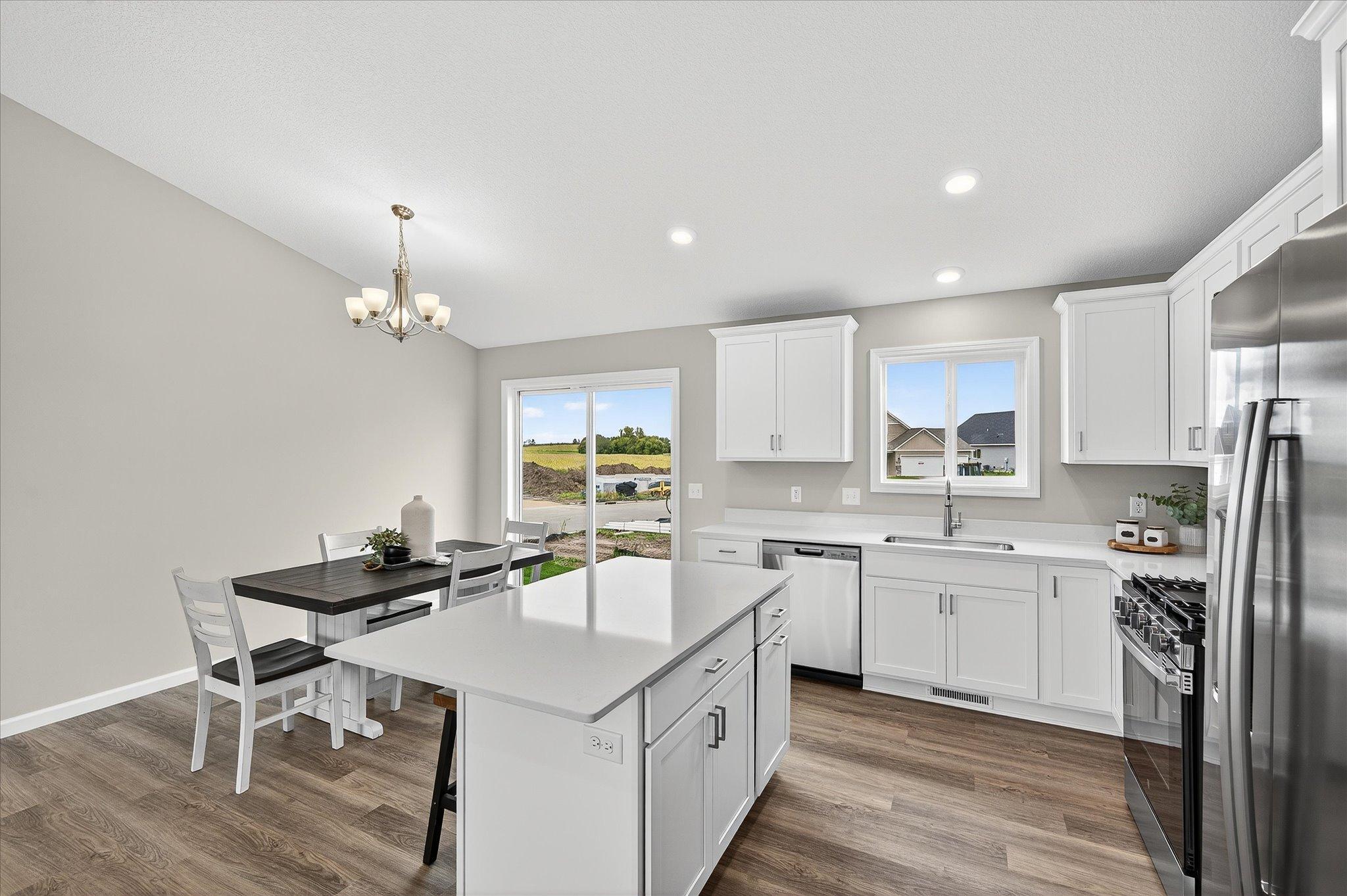 Generous counter space creates a natural place for morning coffee, meal prep, homework, and conversations that last long after dinner. *photos of a previously staged home, not all options & finishes may be exact.*