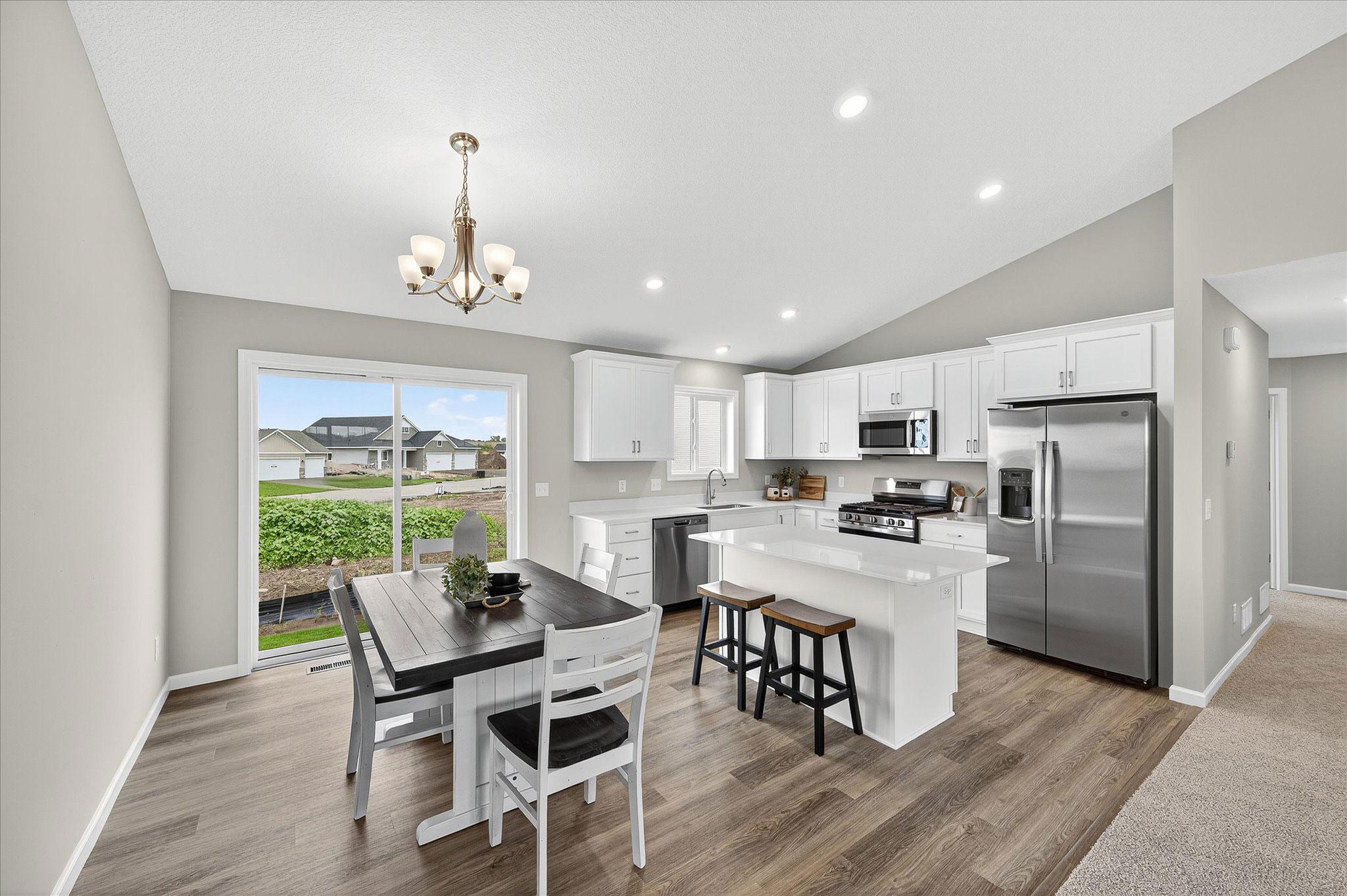 Natural light and an easy connection to the kitchen make this an inviting spot to gather every day. *photos of a previously staged home, not all options & finishes may be exact.*