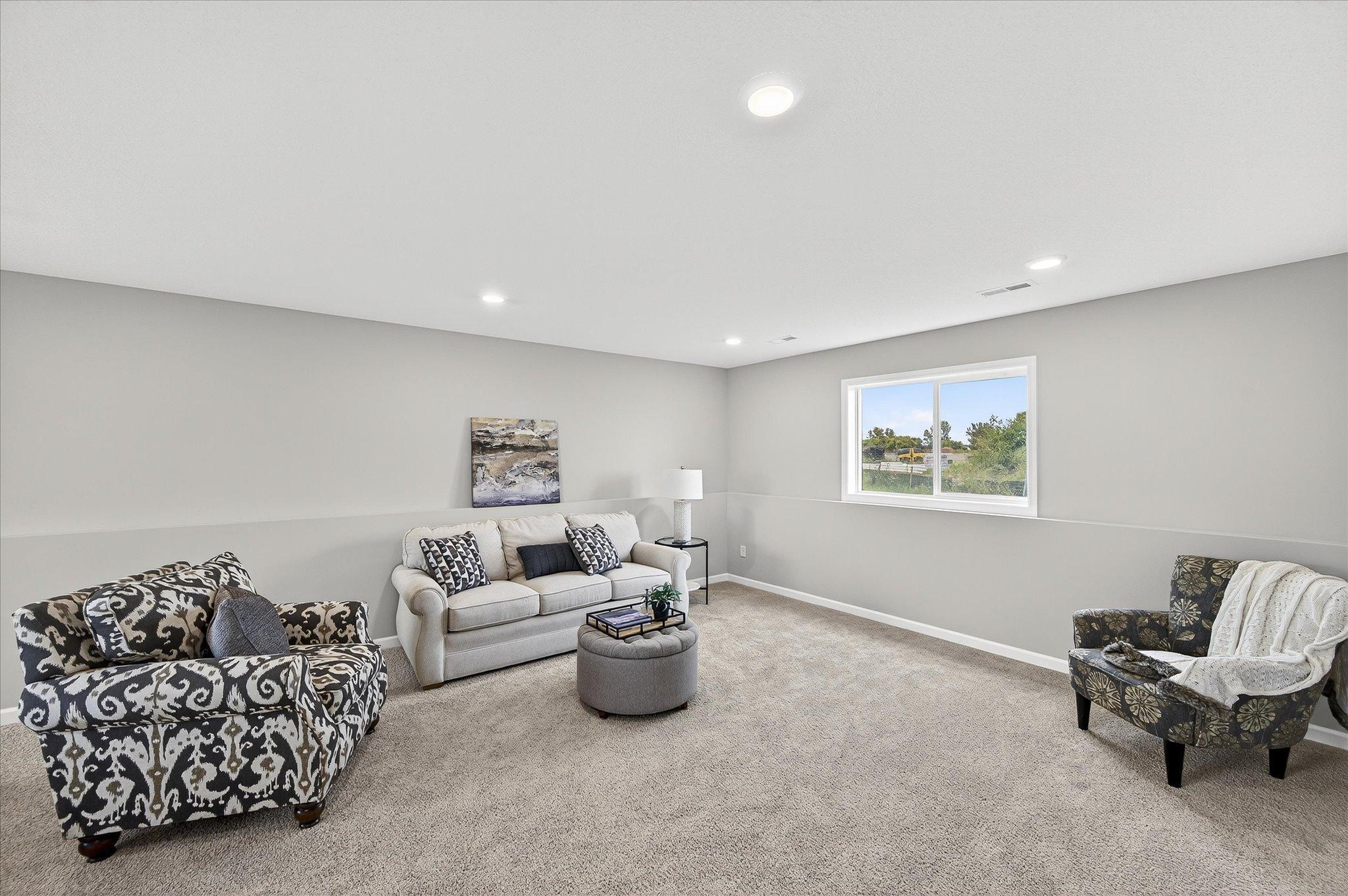 Movie nights, game days, play space, or a teen hangout—the finished lower level gives everyone room to spread out. *photos of a previously staged home, not all options & finishes may be exact.*