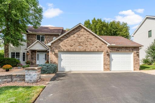 Front of home with meticulous landscaping