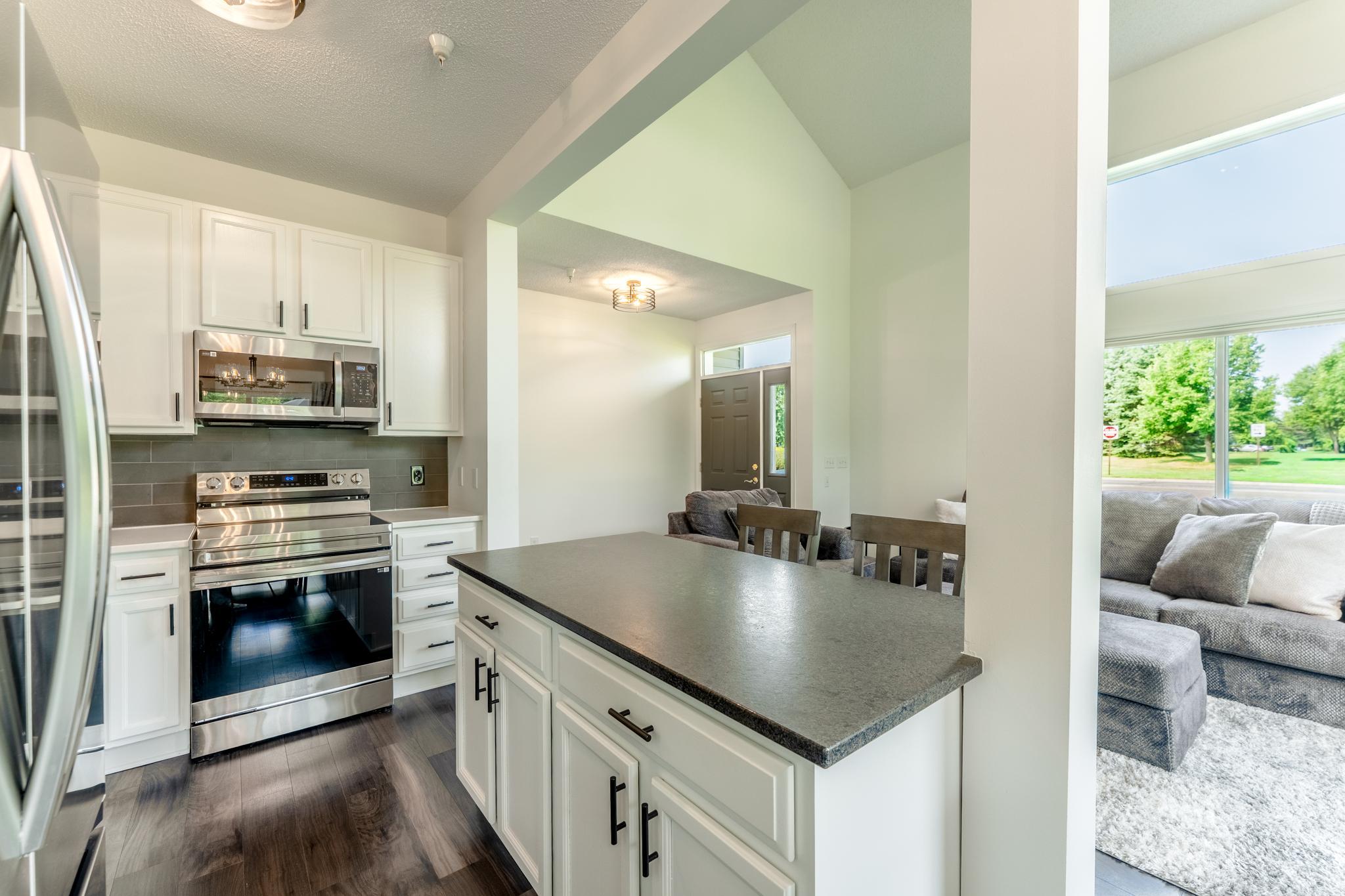Another view of the kitchen, open to the living room.