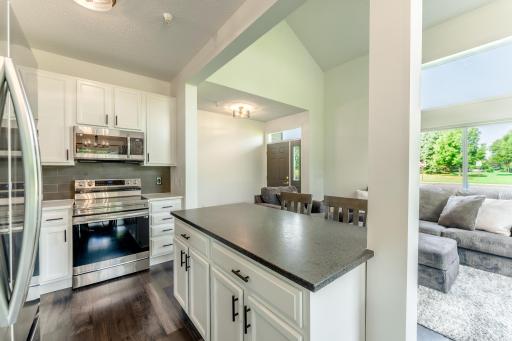 Another view of the kitchen, open to the living room.