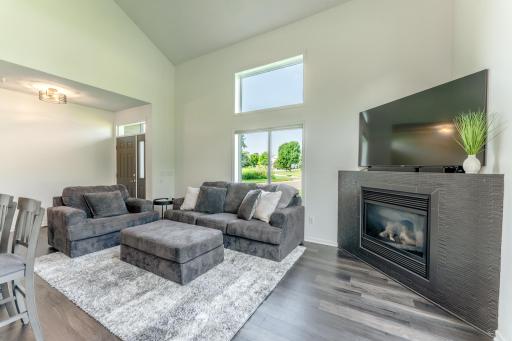Living room is bright but has a gas fireplace keep things cozy when the weather turns cool.