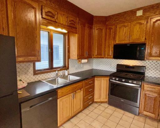Nice working kitchen, all appliances stay, new sink and faucet