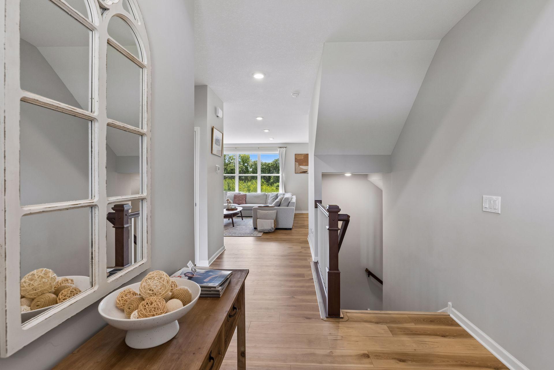From the moment you step inside, warm contemporary finishes and natural light create an atmosphere that feels both welcoming and refined.