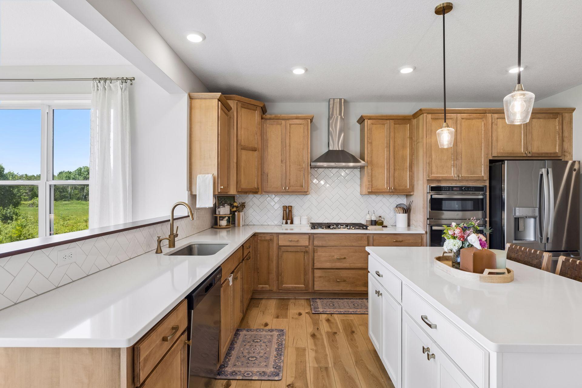 At the heart of the home, the kitchen balances warmth and function through rich textures, premium appliances, and a layout designed for both everyday living and entertaining.