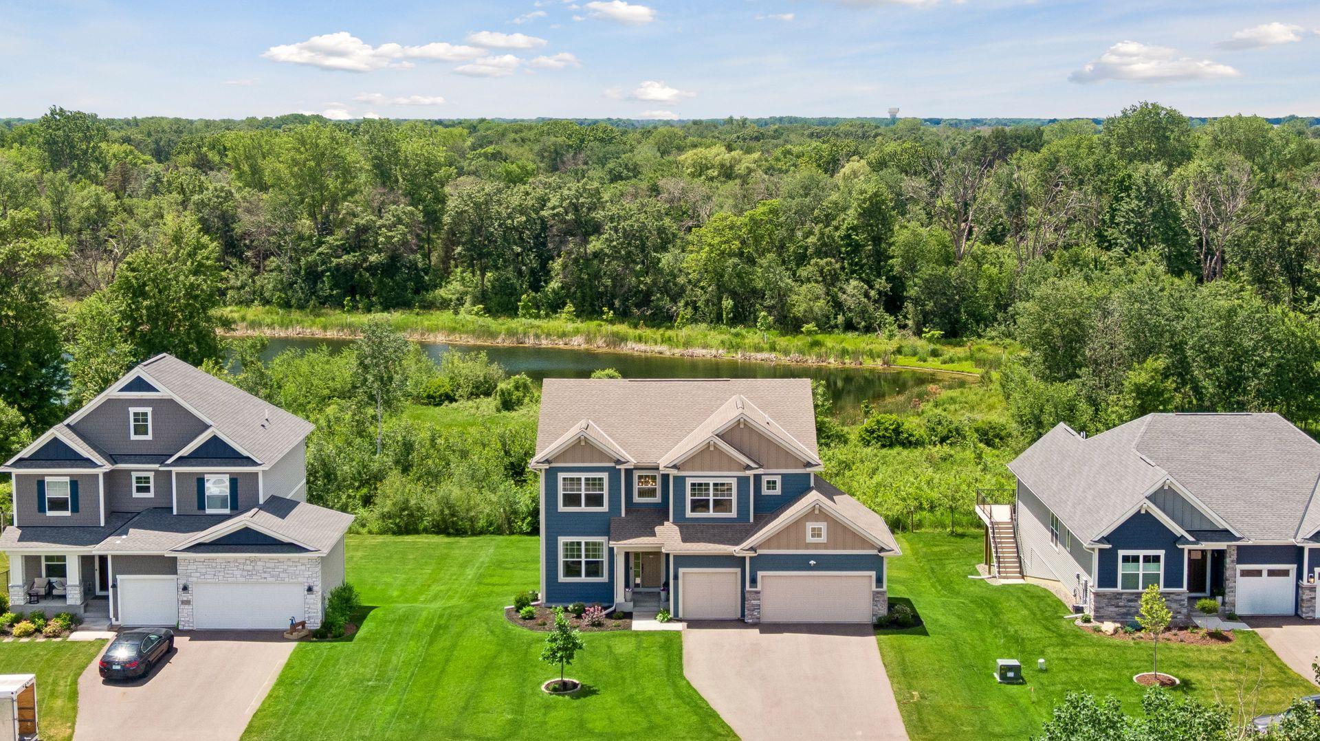 Positioned between peaceful pond views and protected natural surroundings, the home enjoys a setting that feels both private and connected.
