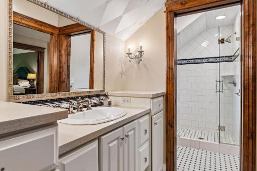 Designed for functionality, the fourth bedroom’s ¾ bathroom offers a large vanity and a separate shower and stool room, creating a well-organized and private layout.