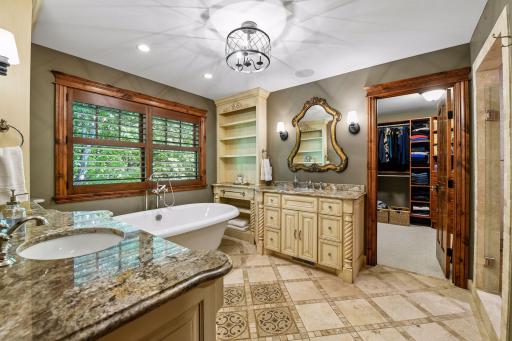 The primary bath flows directly into a large walk-in closet, making everyday routines easy and comfortable.