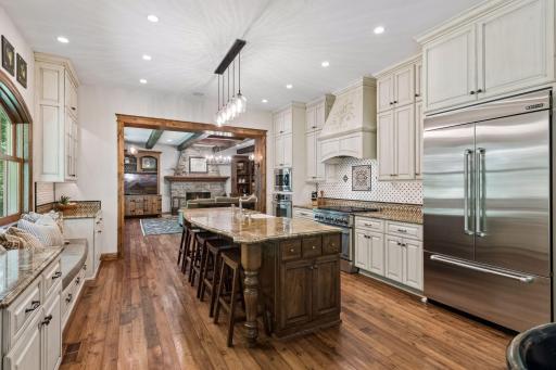 View of the kitchen from the informal eating area, highlighting its spacious and inviting design.