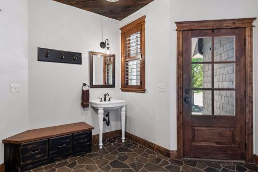 The mudroom includes a handy sink and direct access to the front of the home, perfect for everyday coming and going.