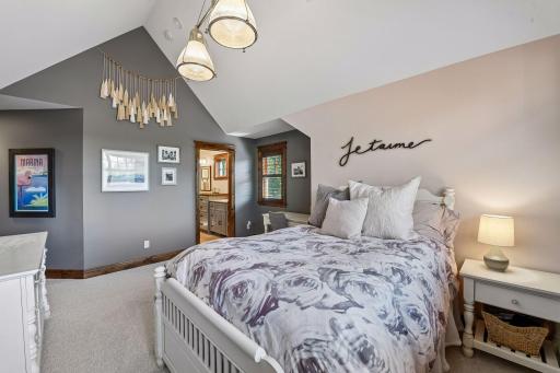 This upper-level third bedroom offers convenient Jack-and-Jill bath access and its own private walk-in closet.