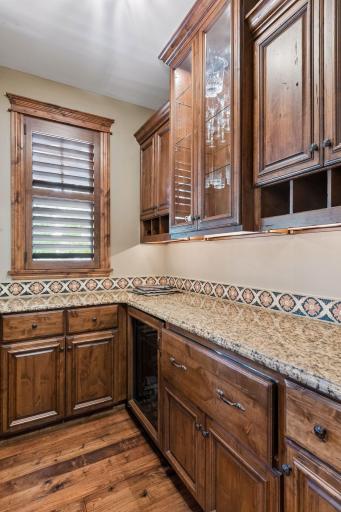 Just off the formal dining room, the butler’s pantry provides additional storage and prep space, making entertaining effortless.