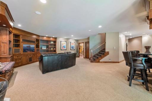An exercise room sits just off the lower-level family room, offering a convenient and private space for workouts.