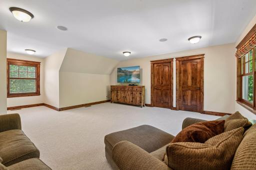 Upper-level bonus room offers flexible use as a TV room, home office, or additional guest space.