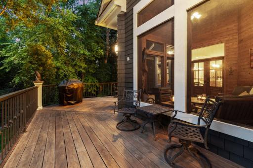 A deck extends off the main-floor 3-season porch, offering a seamless indoor-outdoor living experience.