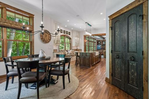 An inviting informal dining area connects directly to the kitchen, with a large pantry just steps away.