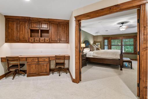 Located beside the primary bedroom suite, the upper-level built-in desk provides a practical and well-placed workspace.