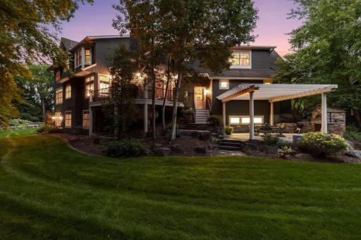 Backyard with lush, green grassy areas that create a beautifully finished outdoor space.
