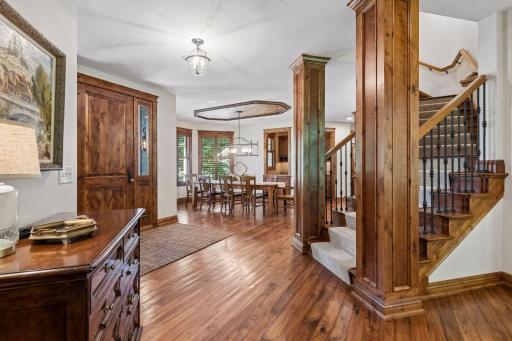View from the living room into the foyer and dining area, highlighting the home’s open and elegant flow.