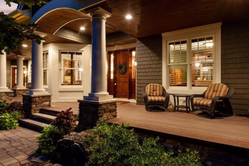 A spacious, welcoming front porch creates the ideal spot to unwind on summer evenings.