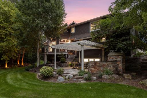A beautiful patio with a pergola & F.B. (Forno Bravo) pizza oven from California sits at the back of the home, creating an ideal private entertaining setting.