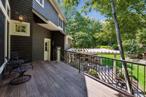 From the main-floor deck, steps take you right down to the backyard patio—perfect for easy outdoor living and entertaining.