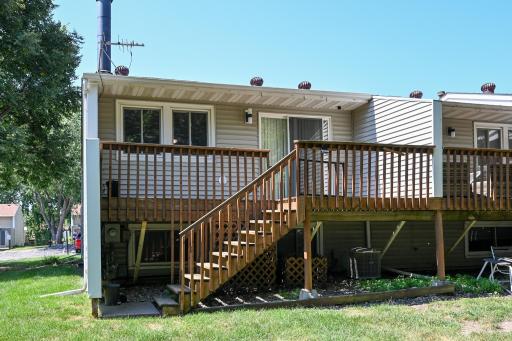 End-unit with deck and stairs to the yard.