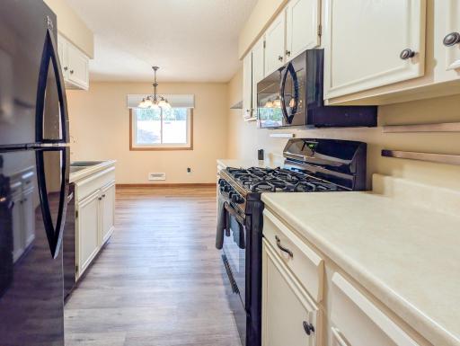 Another view of the kitchen -gas stove and microwave