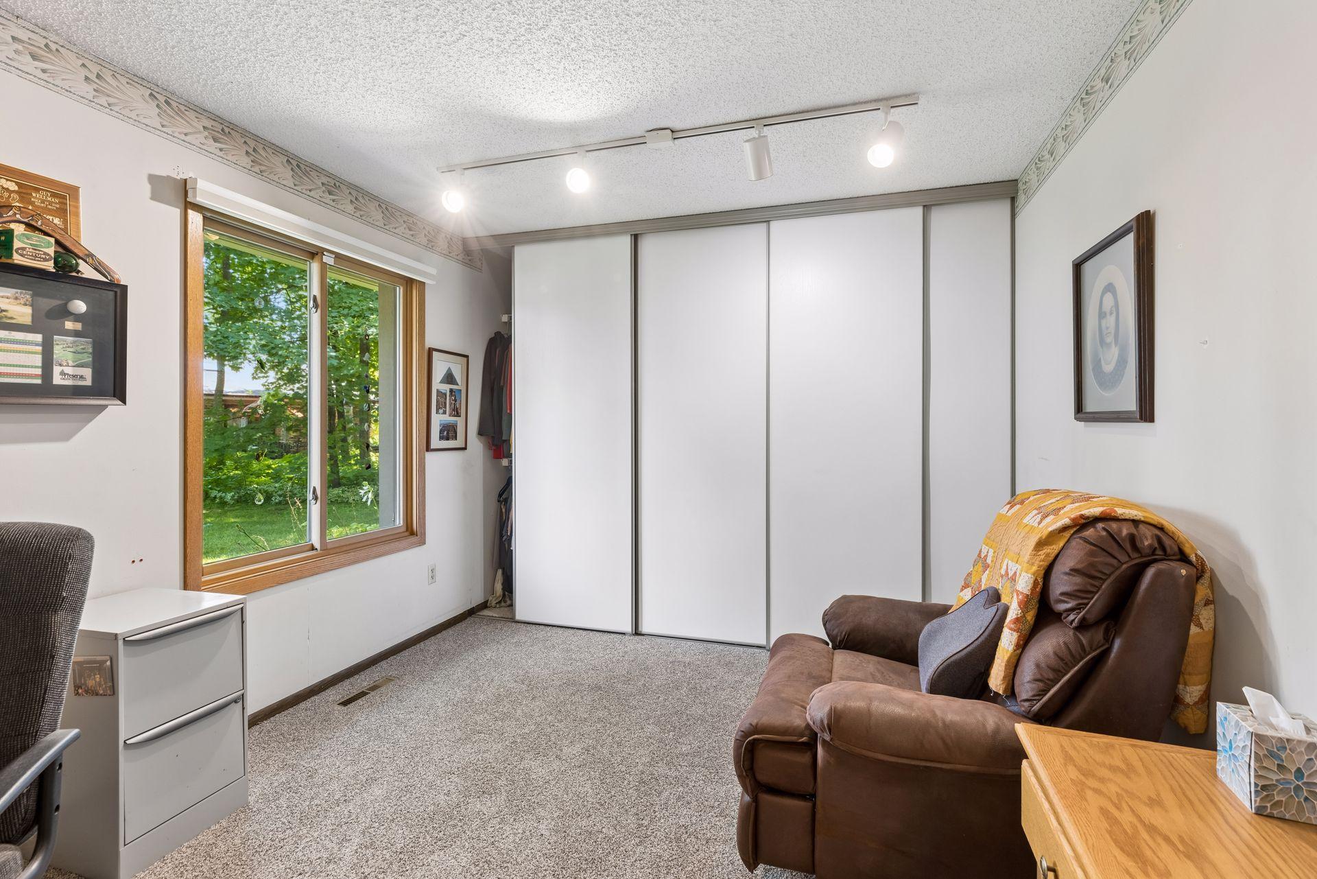 Bedroom #2 with large window overlooking green space