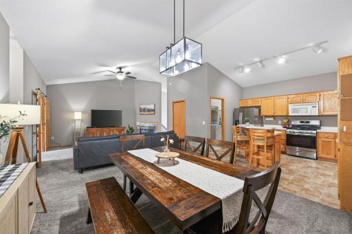 The heart of the home features a beautiful open-concept kitchen, dining, and living space.