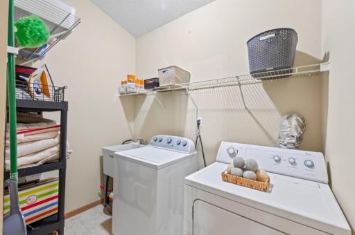 Upstairs, a dedicated laundry room complementing the home's functional layout.