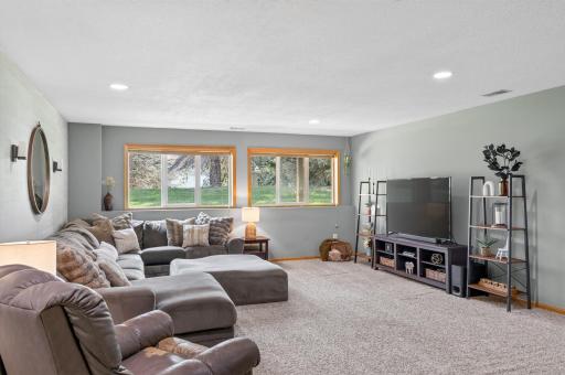 This lower-level family room is flooded with tons of natural light.