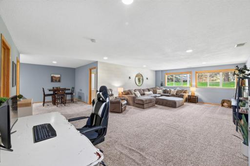 Completely finished and featuring an expansive layout, this lower-level living space is a true host's dream.