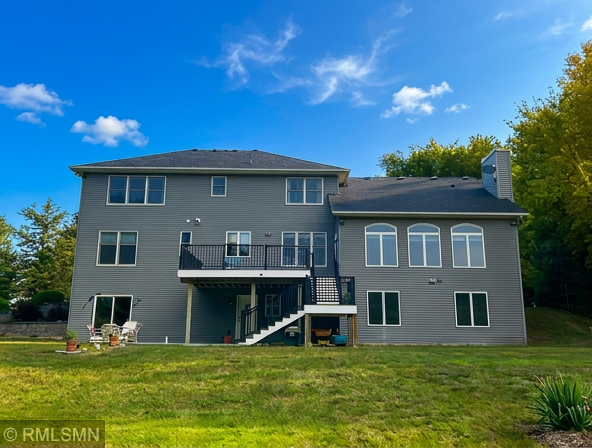 Back of home - lovely maintenance free deck overlooking the private backyard and walkout from the lower level!