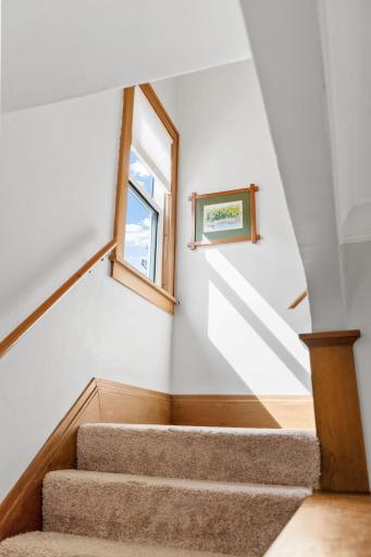 The sunlight beams into the staircase to the upper level