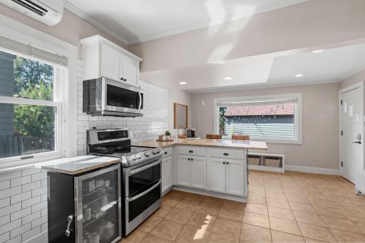 Additional beverage refrigerator stays with the house.
