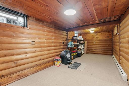 Knotty pine rustic log panelled room - great for office, movie room, fitness room.....