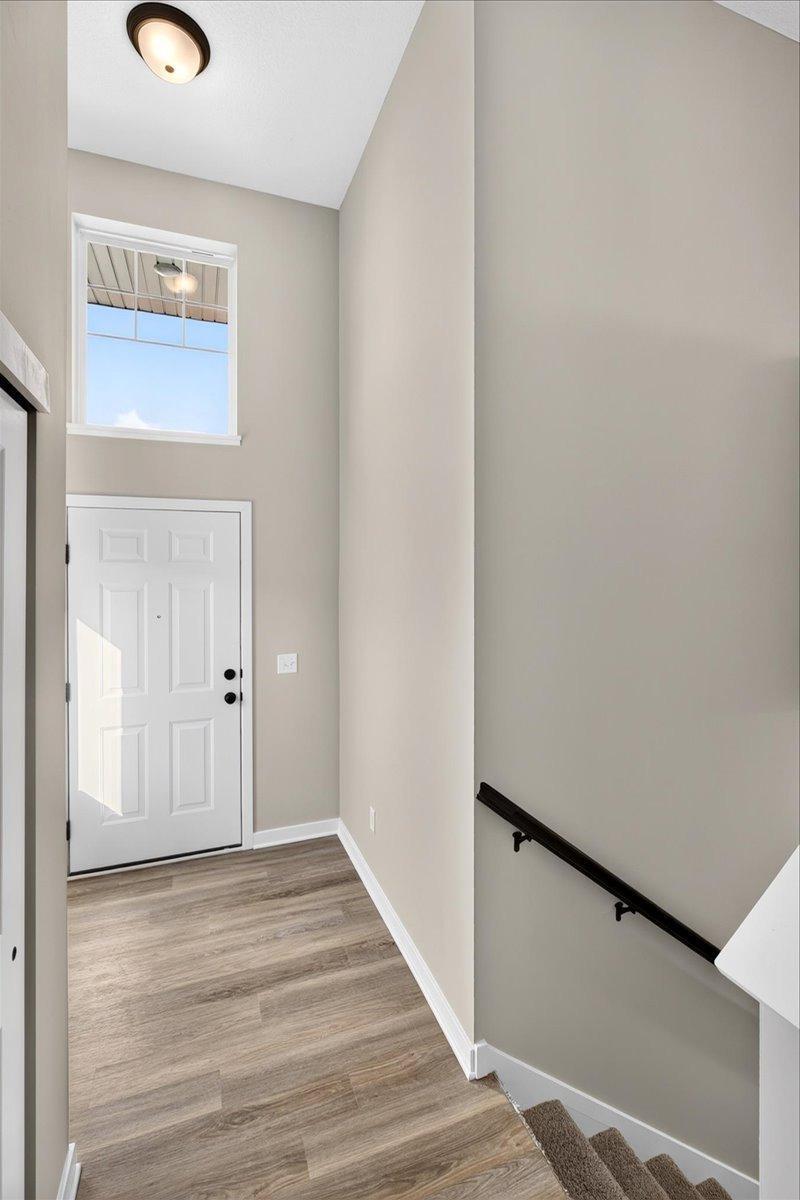 Foyer. Photo taken of another home with similar plan and finishes.