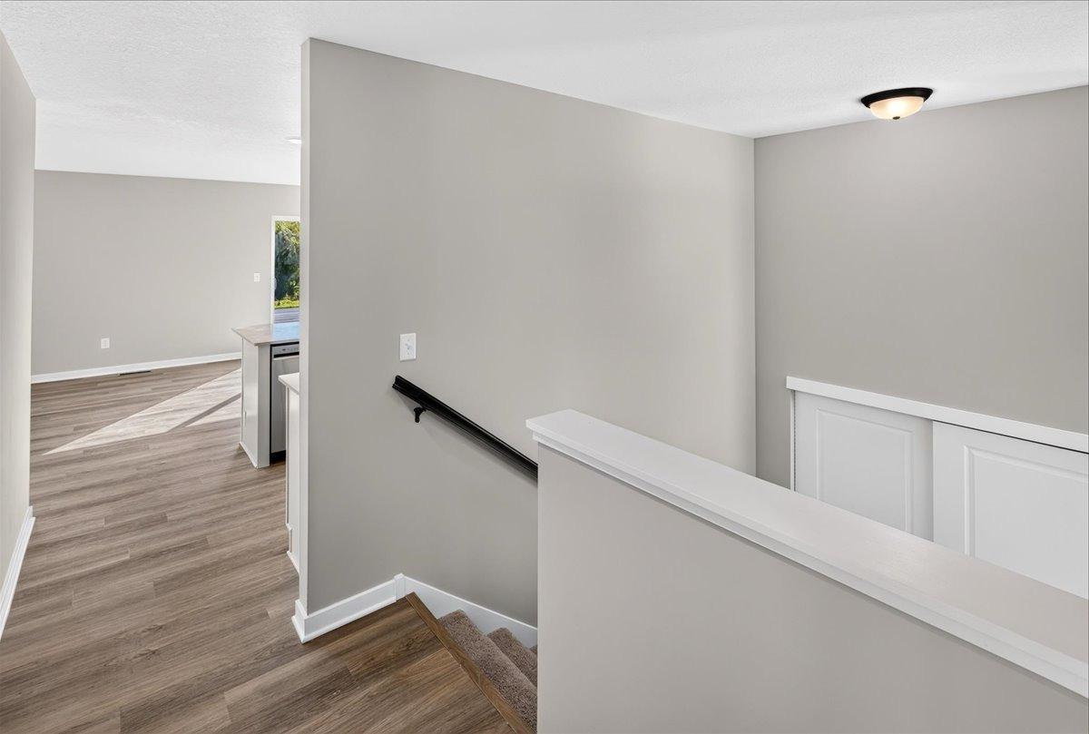Main Level Landing. Photo taken of another home with similar plan and finishes.