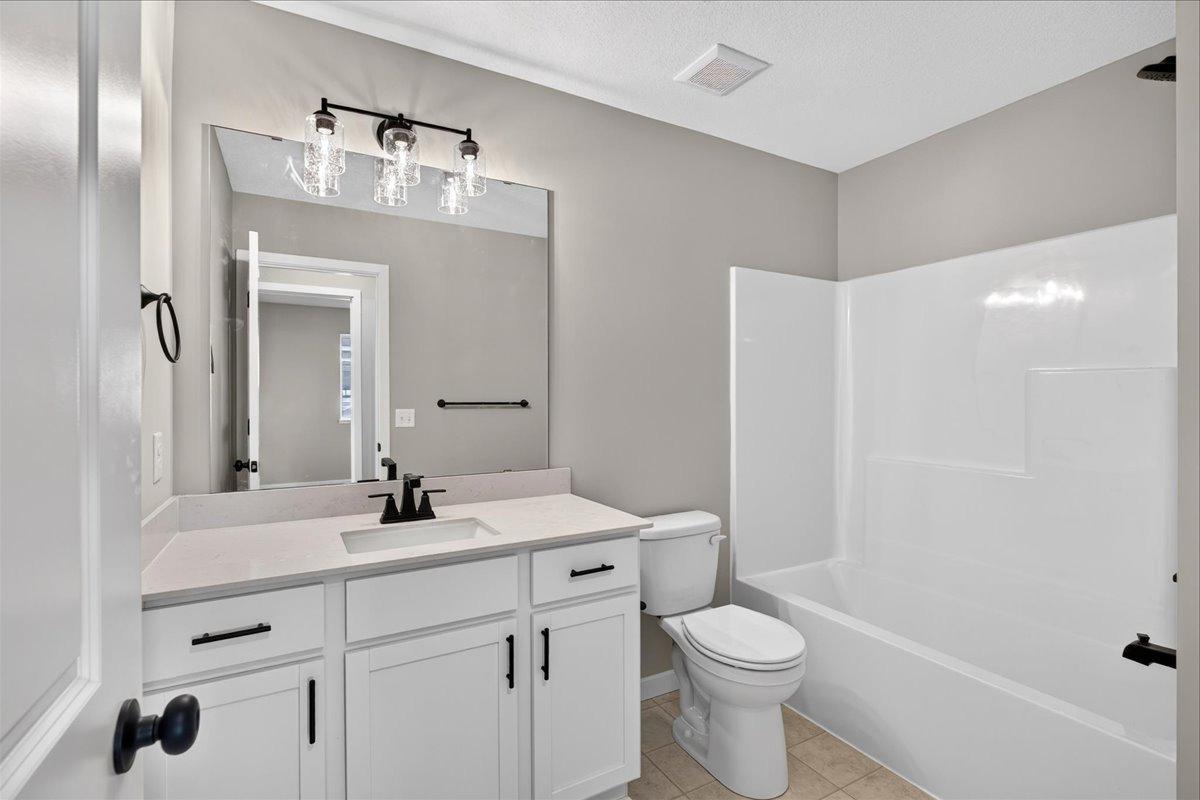Main Bath. Photo taken of another home with similar plan and finishes.