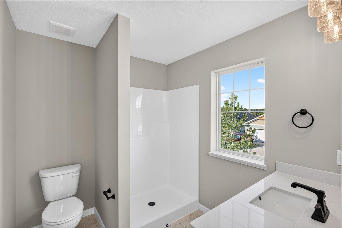Private Primary Bath. Photo taken of another home with similar plan and finishes.