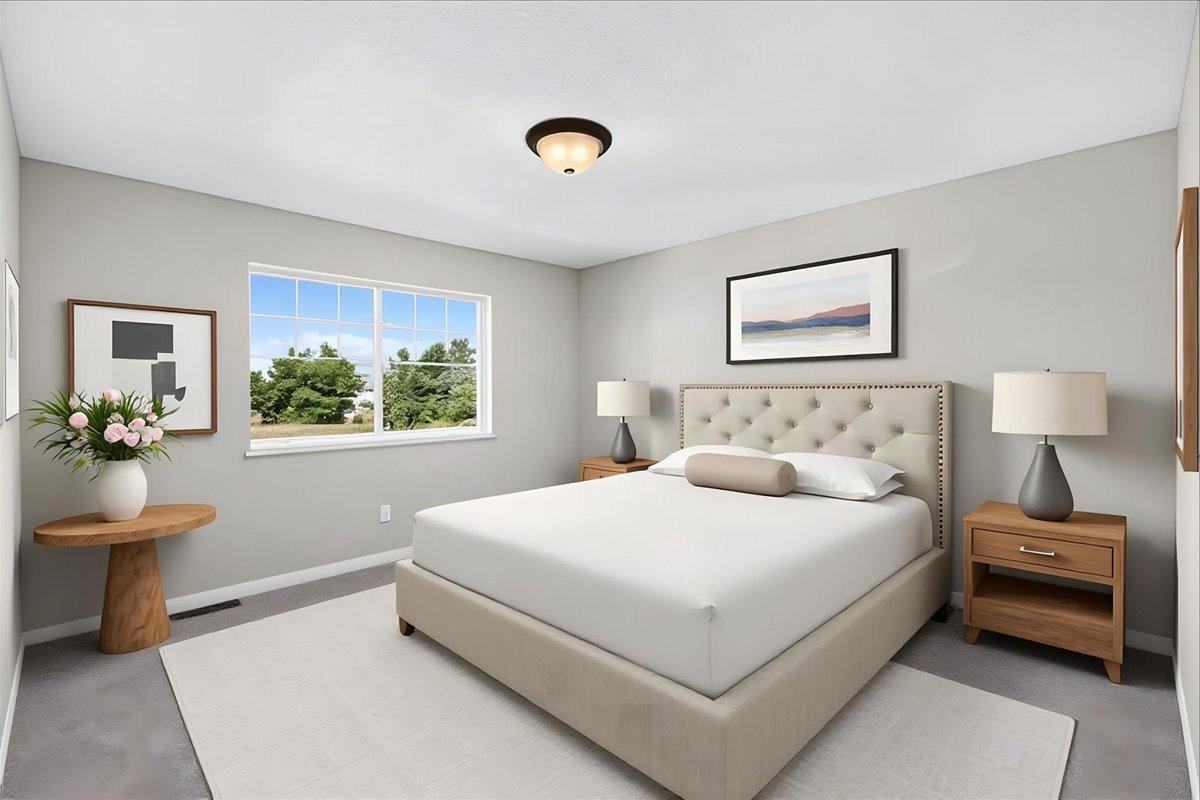 Primary Suite. Photo taken of another home with similar plan and finishes. Virtually Staged.