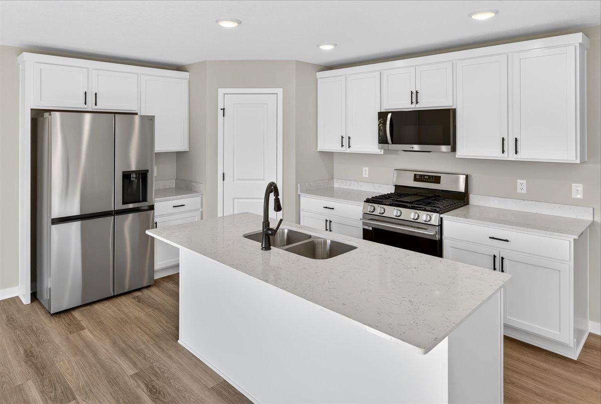Kitchen. Photo taken of another home with similar plan and finishes.