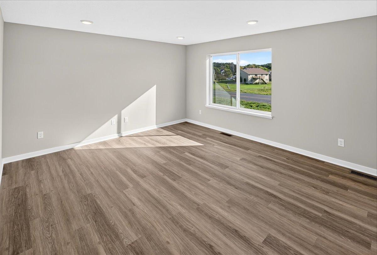 Living Room. Photo taken of another home with similar plan and finishes.