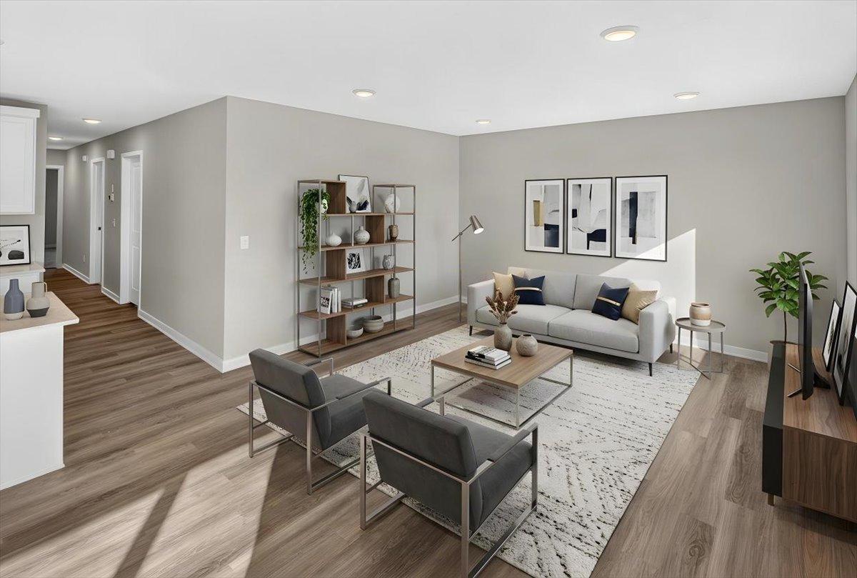 Living Room. Photo taken of another home with similar plan and finishes. Virtually Staged.