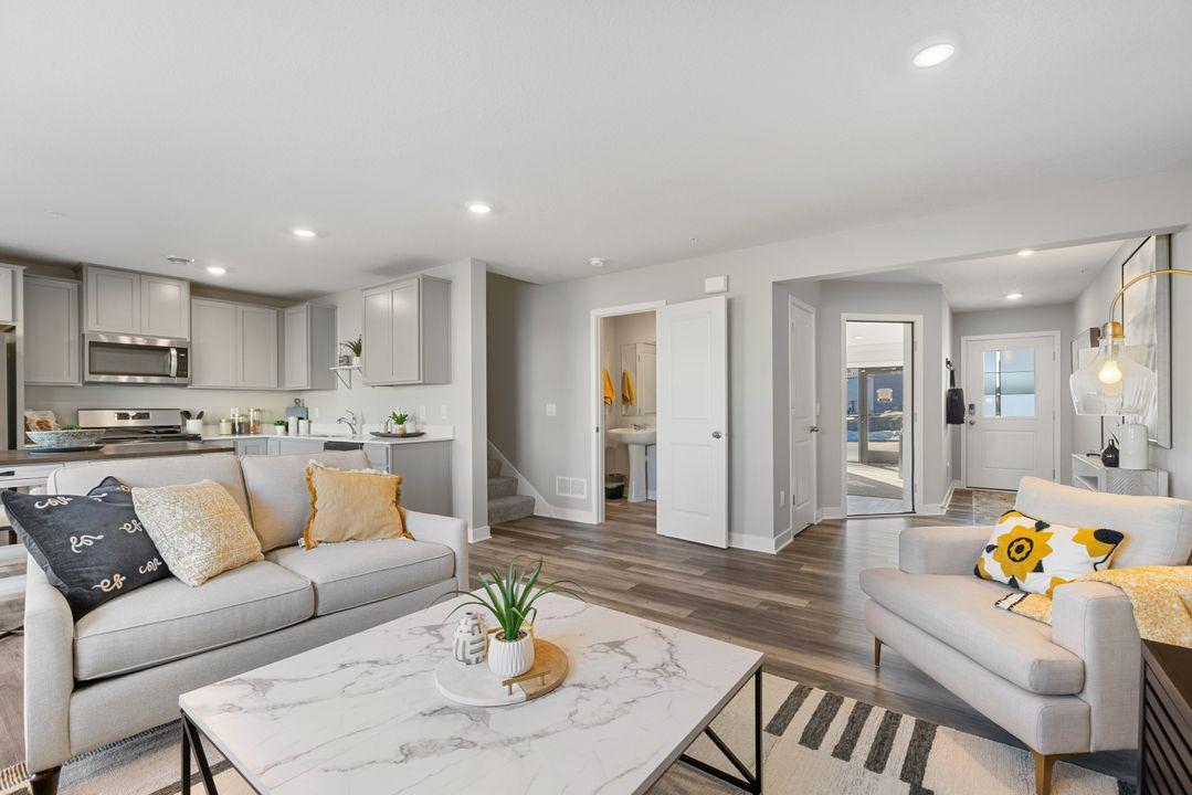 Open concept living. Our smart home package is included in every home. Photo is of model home. Colors and options may vary. Ask Sales Agent for details.