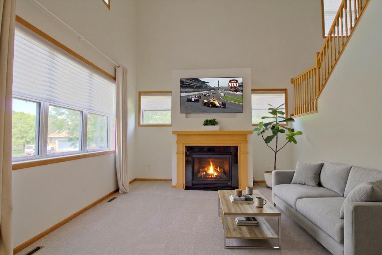 Living Rm with fire and TV Virturally Staged
